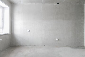 interior of the apartment without decoration in gray colors. rough finish
