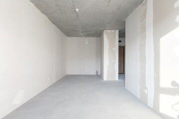 interior of the apartment without decoration in gray colors. rough finish