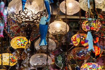 Turkish mosaic lamps or Moroccan lanterns at store. Shop of oriental souvenirs