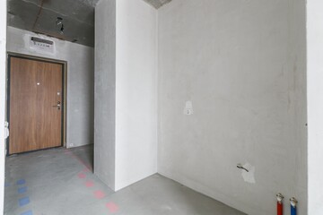 interior of the apartment without decoration in gray colors. rough finish