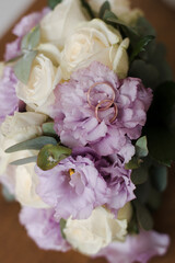 wedding bridal bouquet and wedding rings close-up