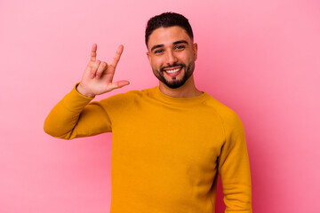 Fototapeta premium Young mixed race man isolated on pink background
