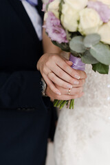 the bride and groom are holding a wedding bouquet together Wedding bouquet