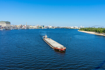 Towboat with big platform on Dnypro river in Kyiv, Ukraine on August 30, 2020. 