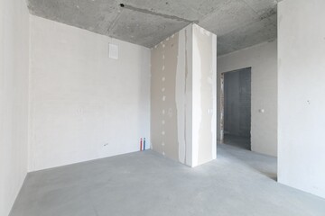 interior of the apartment without decoration in gray colors. rough finish