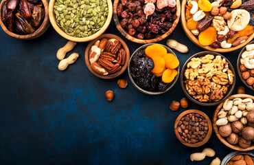 Nuts and dried fruits. Dried apricots, figs, prunes, raisins, cranberries, pecans, walnuts, pistachios, cashews, hazelnuts, almonds and other. Food background, top view