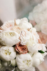 wedding bridal bouquet and wedding rings close-up top view