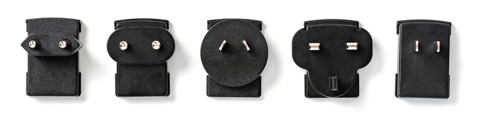 Various black electrical plugs on a white background. Plugs of different countries