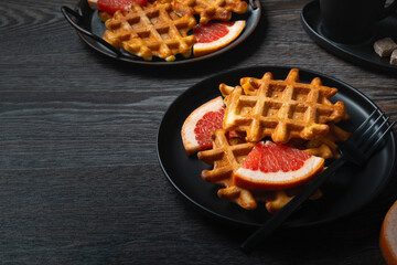 Waffle breakfast with grapefruit and coffee. Copy space.