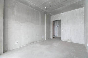 interior of the apartment without decoration in gray colors. rough finish