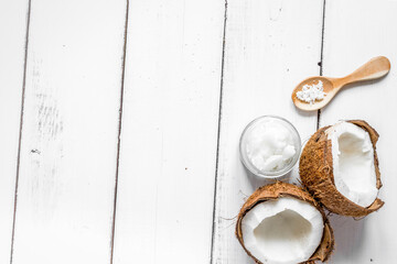 cosmetic concept with fresh coconuts on white table background top view