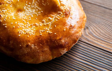 uzbek tortillas on an old wooden background, top view