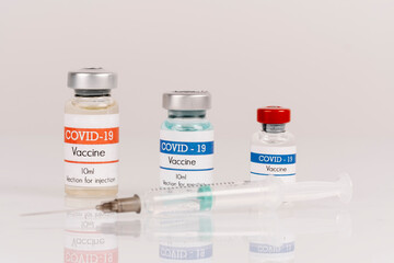 vaccine covid-19 vaccine vials with syringe, on a white background