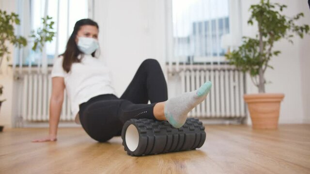 Therapist helping patient to exercise in her studio