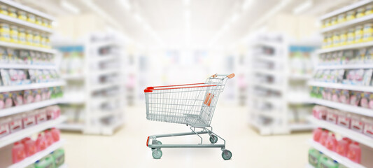 empty red shopping cart in supermarket