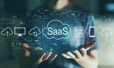 SaaS - software as a service concept with young man in the night