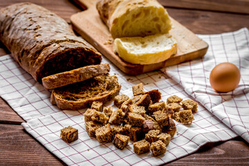 Baking bread ingredients on wooden table background