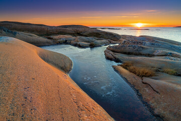 Sunset on skerries in Ytre Hvaler National Park, on the island of Kirkeoy in Norway, Scandinavia, Europe