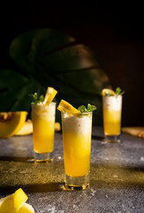 Photo for bar concept or magazines. Glasses of melon drink on dark background. Fresh and summer drink. laid out in layers with whipped cream