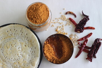 Indian pancakes also known as dosa made with fermented batter of rice and lentils. Served with idli...