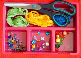 Creativity and hobbies, embroidery and sewing, scissors, thread, beads, crystals in the box, top...