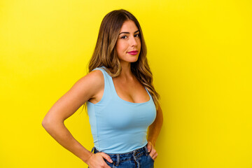 Young caucasian woman isolated on yellow background