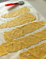 fresh dough rolled out with a rolling pin