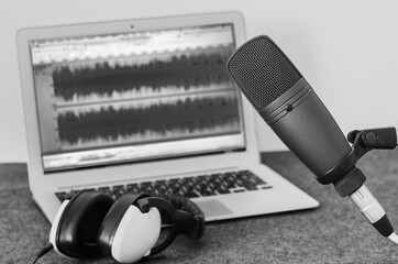 home recording studio: laptop, microphone and headphones