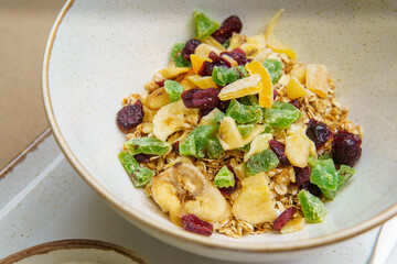 Plates with muesli and yogurt on the table. Oatmeal with fruit and yogurt. Healthy eating. Light and tasty breakfast. Diet