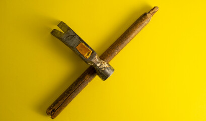 A broken hammer on a yellow background. Cool banner for DIY advertising