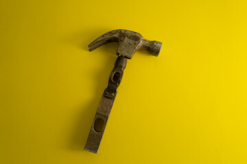 A broken hammer on a yellow background. Cool banner for DIY advertising