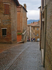 Italy, Marche, Urbino,downtown medieval street. 