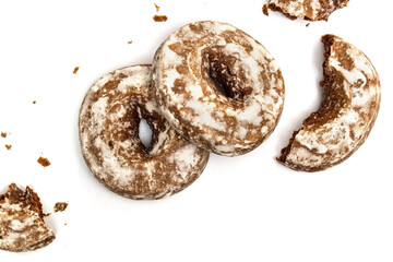 Chopped gingerbread cookies with sugar icing isolated on white background with clipping path top view