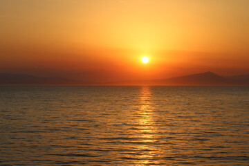 Fototapeta na wymiar Beautiful Sunset near Cyclades of Aegean Sea in Greece