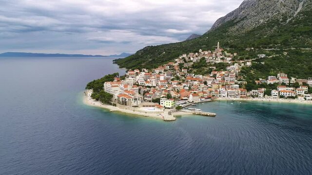 Igrane village on Makarska riviera and Biokovo mountain aerial sea view, Dalmatia region of Croatia