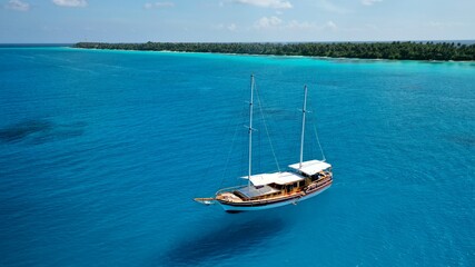 Scuba diving, diving in the ocean on boats and ships from a bird's eye view, Maldives
