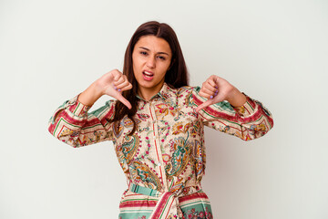 Young Indian woman isolated on white background showing thumb down and expressing dislike.