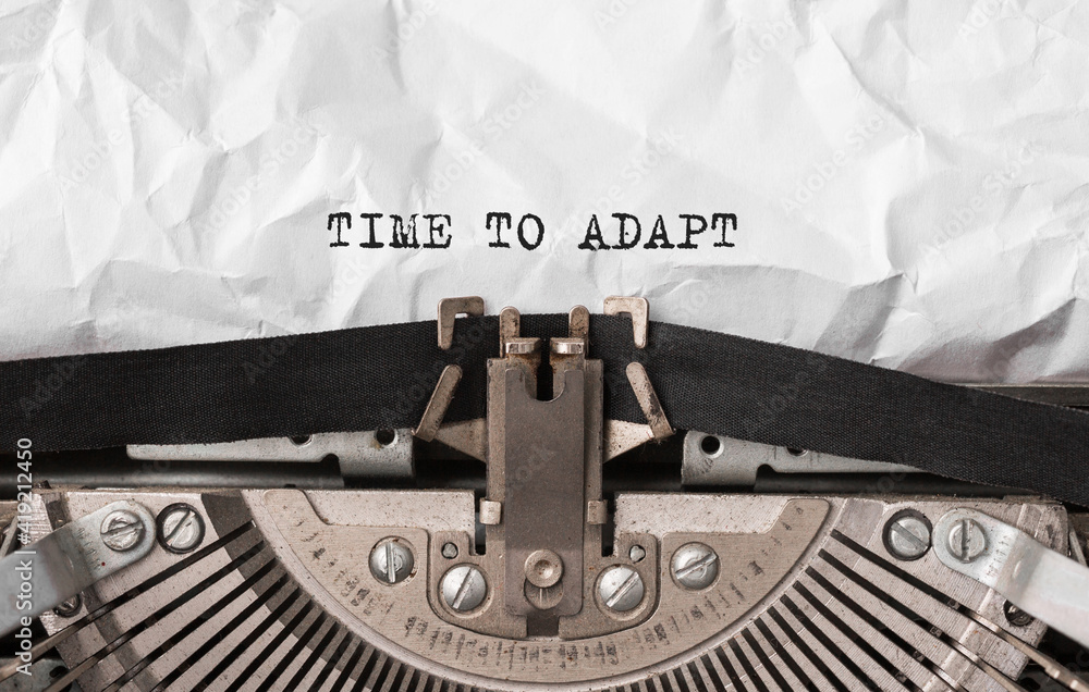 Poster text time to adapt typed on retro typewriter