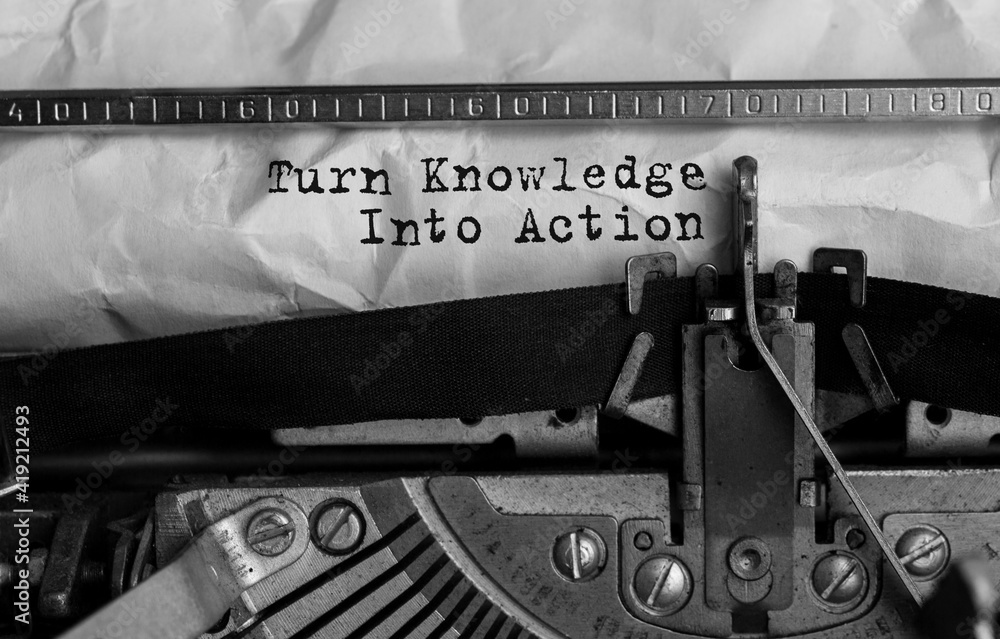Poster text turn knowledge into action typed on retro typewriter