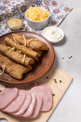 Pancakes on a plate with ham and cheese