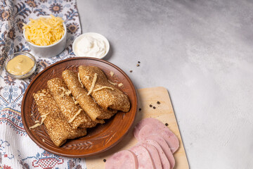 Pancakes on a plate with ham and cheese