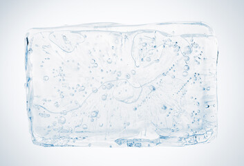 Crystal clear natural ice block with air bubbles, isolated on white background.