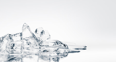 Crushed melting ice pieces on a mirror reflective surface.