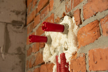 pipes in isolation are fixed by mounting foam