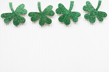 St Patricks Day shamrocks on white background with copy space