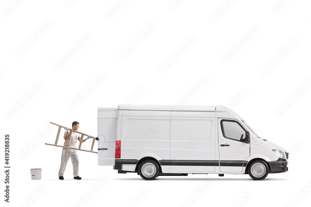 Wall mural painter decorator putting a ladder in the back of a van