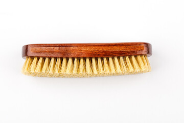 Horsehair brush for polishing leather shoes, on a white background.