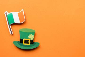 St Patricks Day symbols on orange background with copy space