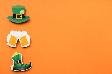 St Patricks Day symbols on orange background with copy space