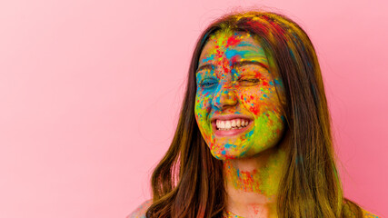 Naklejka premium Young Indian woman celebrating holy festival isolated on white background